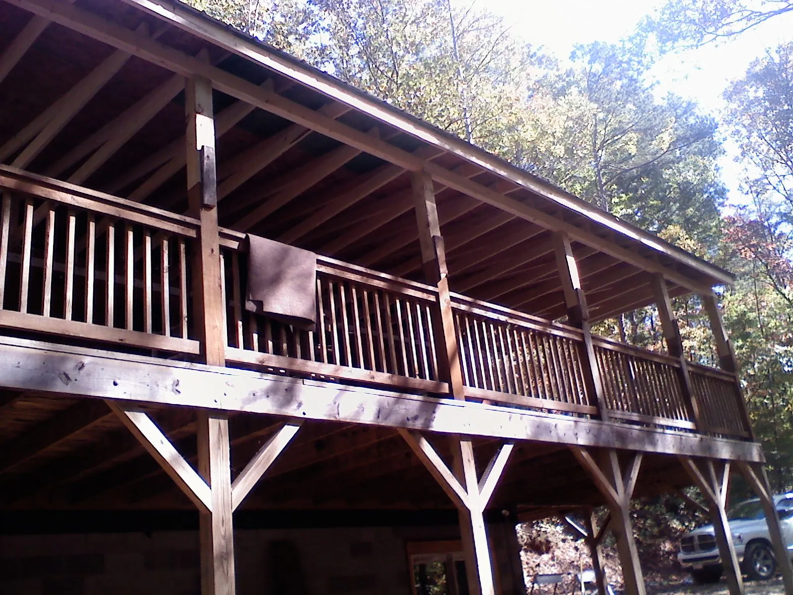 Timber framing under a new elevated porch and deck — Roof Leak Repair in North Adams by Roofing Brothers